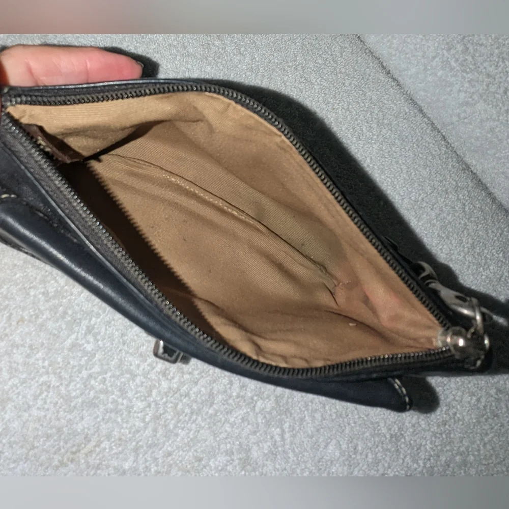 Coach black leather turn lock flap wristlet.